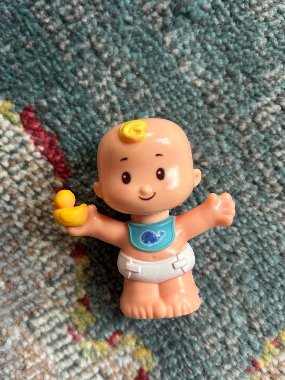 Fisher-Price Little People baby figure holding a yellow rubber duck 2019